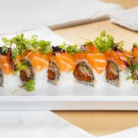 Christophe Roll · Cucumber, steamed shrimp, spicy tuna inside with salmon on top served with microgreens, tobi...