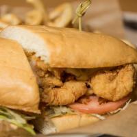 Gulf Shrimp Poboy Sandwich · Sumptuous gulf shrimp on a hoagie roll with mayo, lettuce, and tomato.