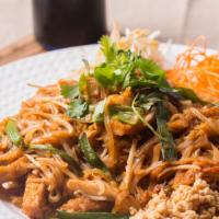 Pad Thai · Thin rice noodles stir fried with tofu, bean sprouts, egg, crushed peanuts, green onions, an...
