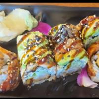 Dragon Roll · Shrimp tempura ,cucumber wrapped with eel and avocado .Drizzled with eel sauce and sesame se...