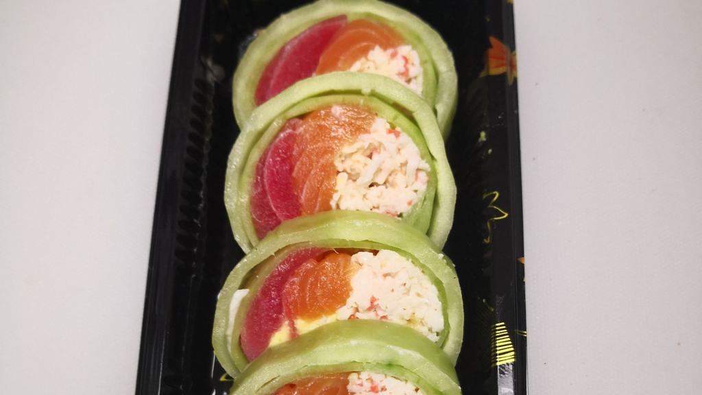 Naruto  · Salmon Tuna Avocado and Imitation Snow Crab inside Wrapped with Cucumber Drizzed with Chef Special Naruto Sauce.
