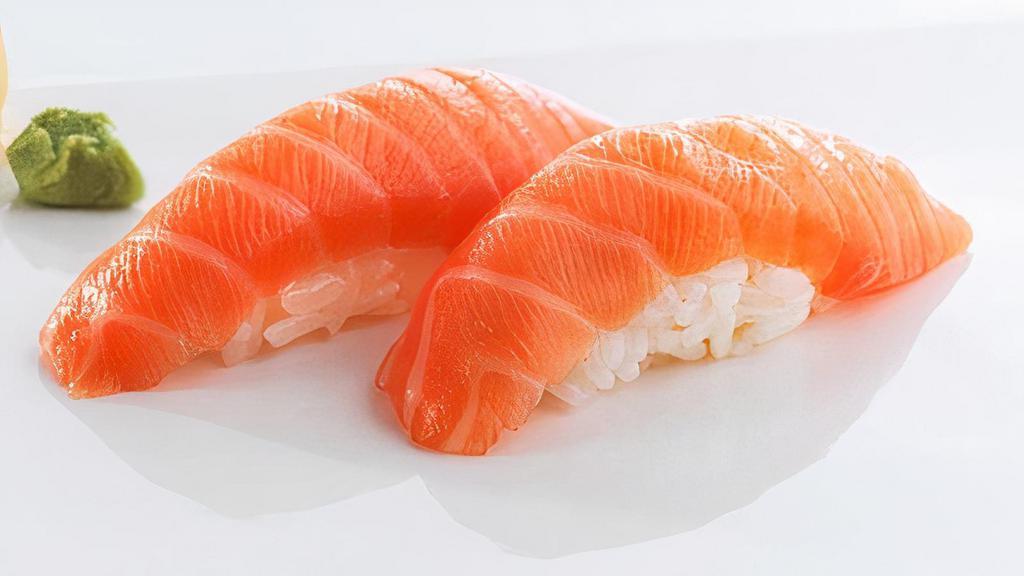 Scottish Salmon (2 Pcs) · Scottish, sushi rice topped with slices of raw fish.