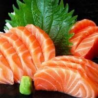 Salmon Sashimi · 3 Slices of salmon and rice less.