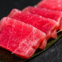 Tuna Sashimi · 3 Slices of tuna and rice less.