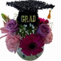 Grad Designers Choice  · Grad Designers Choice Arrangement with fresh flowers and grad cap decor.