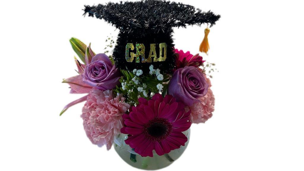 Grad Designers Choice  · Grad Designers Choice Arrangement with fresh flowers and grad cap decor.