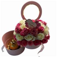 Love Blooming  · Love Blooming Arrangement.  Comes in our signature keepsake box with Ferrero Rocher Chocolat...