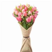 Tulips In Burlap Wrap · 20 Beautiful Tulips with greenery in burlap wrap and floral foam complimented witha beautifu...