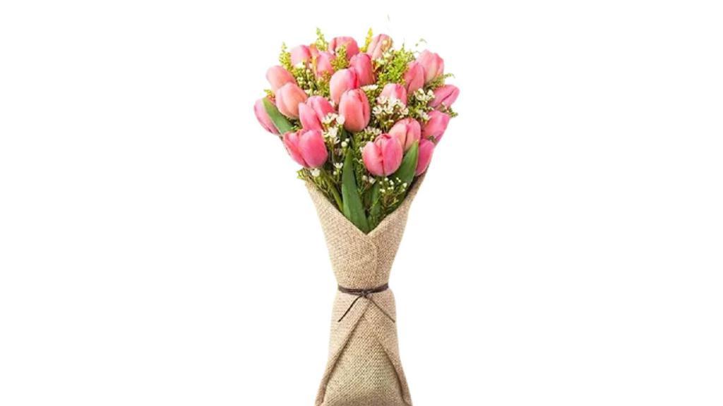 Tulips In Burlap Wrap · 20 Beautiful Tulips with greenery in burlap wrap and floral foam complimented witha beautiful silk ribbon.