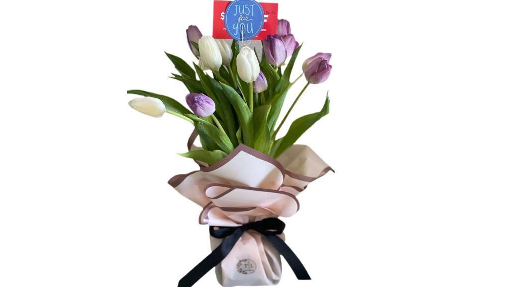 Blooming Tulips Bouquet · This bouquet 10-15  beautiful blooming tulips still in bud and blooming form in our signature wrap with floral foam.