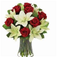 Lily And Rose Bouquet Vase · Beautiful Lily and Rose Arrangement in a glass vase with greenery and filler.