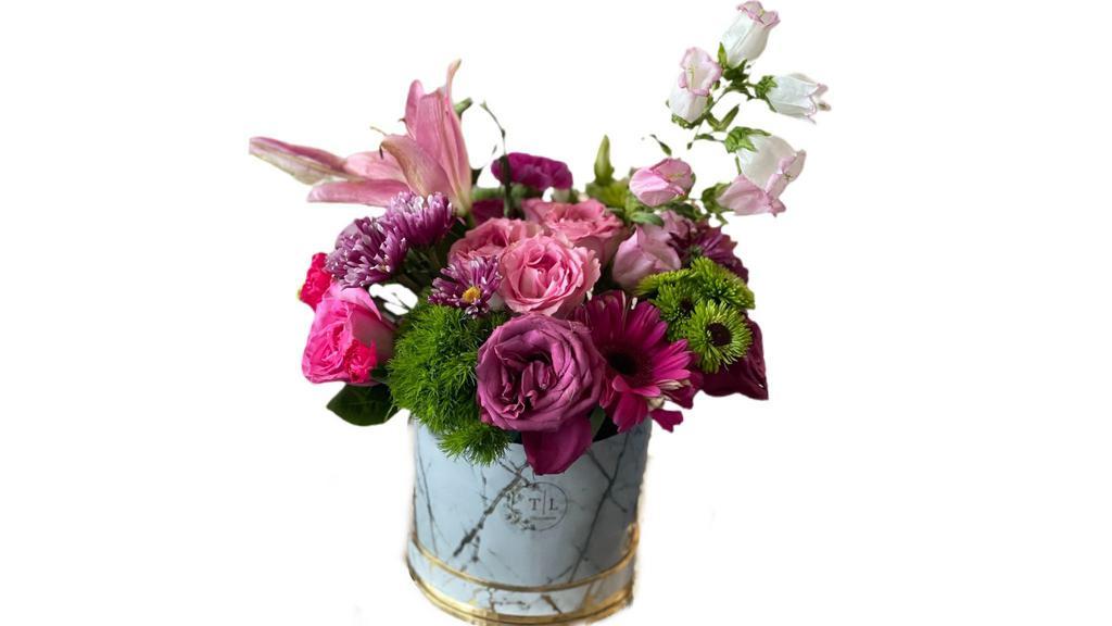 Deluxe Spring Arrangement Bouquet · This beautiful spring arrangement is composed of an assortment of bright beautiful spring flowers comes in our signature marble box.