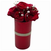 Love Funnel · 5  beautiful red roses in a cylinder shaped planter. Arrangment is composed of 5 beautiful r...