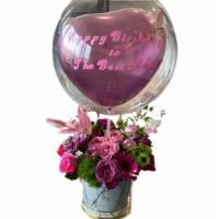 Deluxe Spring Arrangement With Heart And Bubble Balloon · This beautiful spring arrangment is composed of an assortment of bright beautiful spring flo...