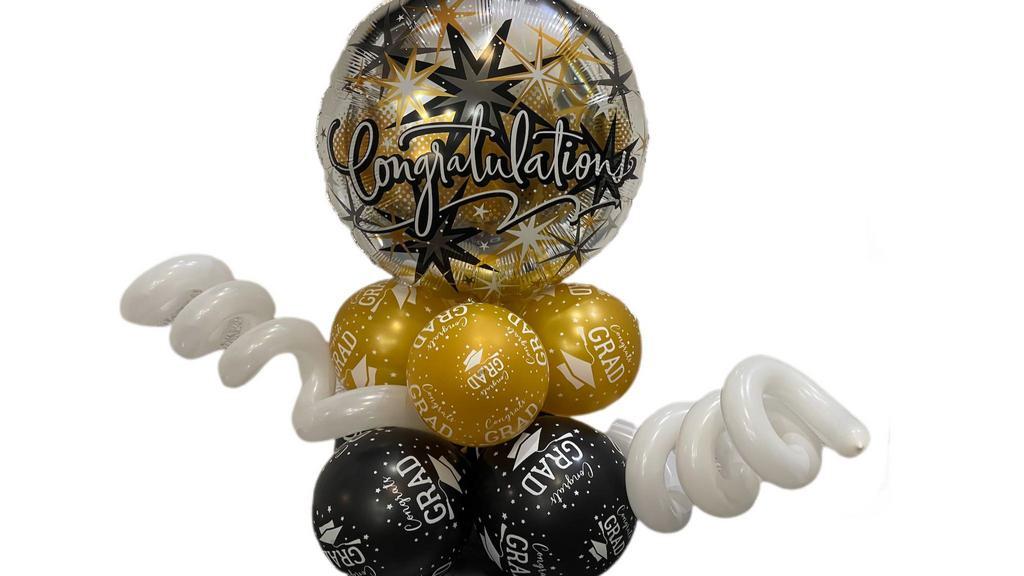 Congrats Grad Balloon Column  · Congrats Grad Balloon Colum is made of 8 latex conragts grad ballons and one mylar balloon.  This arrangement is also accented with spiral balloons.

Other colors Available upon Request.