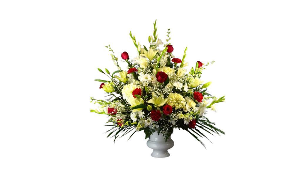 Deluxe Hope Arrangement  · White and Claissic Blooms with acccents of red in a white planter.