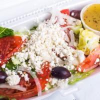 Greek Salad · Lettuce, tomatoes, cucumbers, green peppers, onions, olives, feta cheese and half a pita.