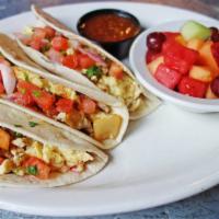 Build Your Own Breakfast Tacos · 3 flour tortillas filled with egg and any 3 ingredients: ham, bacon, sausage, Canadian bacon...