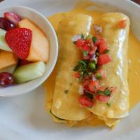 Migas Enchiladas · A variation on one of our favorites... migas wrapped in corn tortillas topped with our aweso...