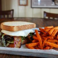 Breakfast Blt · 2 slices of toasted sourdough bread with bacon, lettuce, tomato, fried egg and mayo served w...
