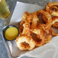 Homemade Onion Rings · Texas-sized, hand-battered-to-order and served with honey mustard.