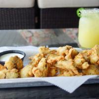 Jalapeño Fries · Strips of jalapeños battered, fried and served with ranch dressing.
