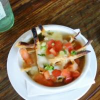Tortilla Soup · An ozona staple homemade chicken tortilla soup topped with fresh tomatoes chives tortilla st...