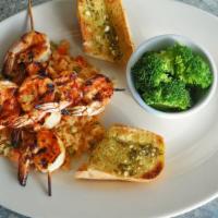 Grilled Shrimp · 1/2 lb. of marinated and grilled jumbo shrimp served on a bed of Spanish rice with garlic br...