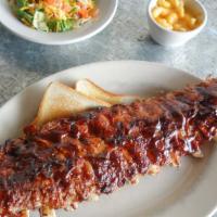 Baby Back Ribs · A full rack slow grilled for tenderness and topped with our classic bbq sauce or sweet and s...