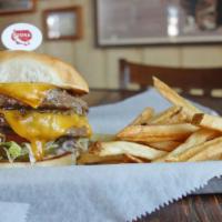 Ozona Burger · Double-meat and double-cheese.... it's absolutely huge! Two 1/2 lb. all- natural beef pattie...