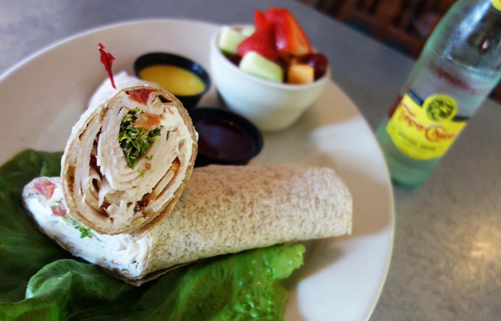 Turkey Wrap · 100% whole wheat tortilla with cream cheese spread, Boar’s Head turkey, sunflower seeds, sprouts and tomatoes served with a side of honey mustard and cranberry relish