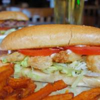 Shrimp Po-Boy · Marinated baby shrimp lightly breaded in our spicy batter served on French bread with lettuc...