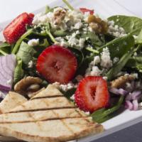 Spinach Salad · Baby spinach, fresh orange slices, red onions, crumbled feta cheese, and walnuts tossed with...
