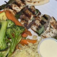 Grilled  Souvlaki · Your choice of protein marinated overnight in our signature recipe then skewered with onions...