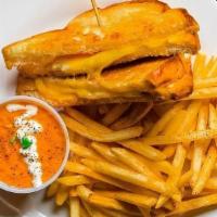 Grilled Cheese & Tomato Bisque · Sourdough, Swiss cheese, Gouda cheese, side of tomato bisque, shoestring fries.