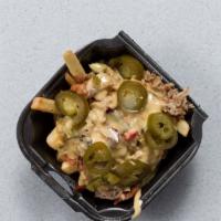 Loaded Fries · Pulled Pork or Chicken, Bacon, Jalapeño, and Queso.