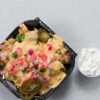 Ultra Loaded Fries · Pulled Pork or Chicken or Steak, 3 Types of Cheese, Bacon, Jalapeños, Sour Cream, Pico De Ga...