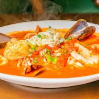 Cioppino · Savory Italian tomato stew with shrimp, fish, mussels, clams, calamari & jumbo crab, accente...