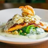 Saltwater Seafood Trio · Saltwater recommends. Pan-roasted Atlantic salmon, topped with two grilled Cajun-spiced shri...