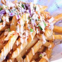 Kimchi Fries · Topped with onion, kimchi, scallion, and spicy mayo drizzled on top.