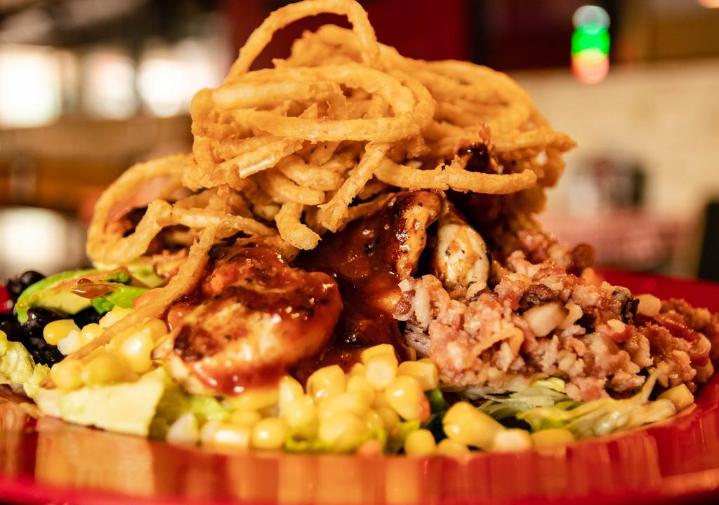 Southwest Chicken Salad · BBQ grilled chicken, bacon, cheese, corn, black beans, tomato, avocado slices with crispy fried onions and tasty BBQ ranch dressing.