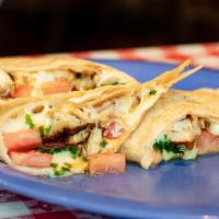 Quesadilla · Beef, chicken, pork, or spinach and mushroom quesadillas. Served with homemade salsa, guacam...