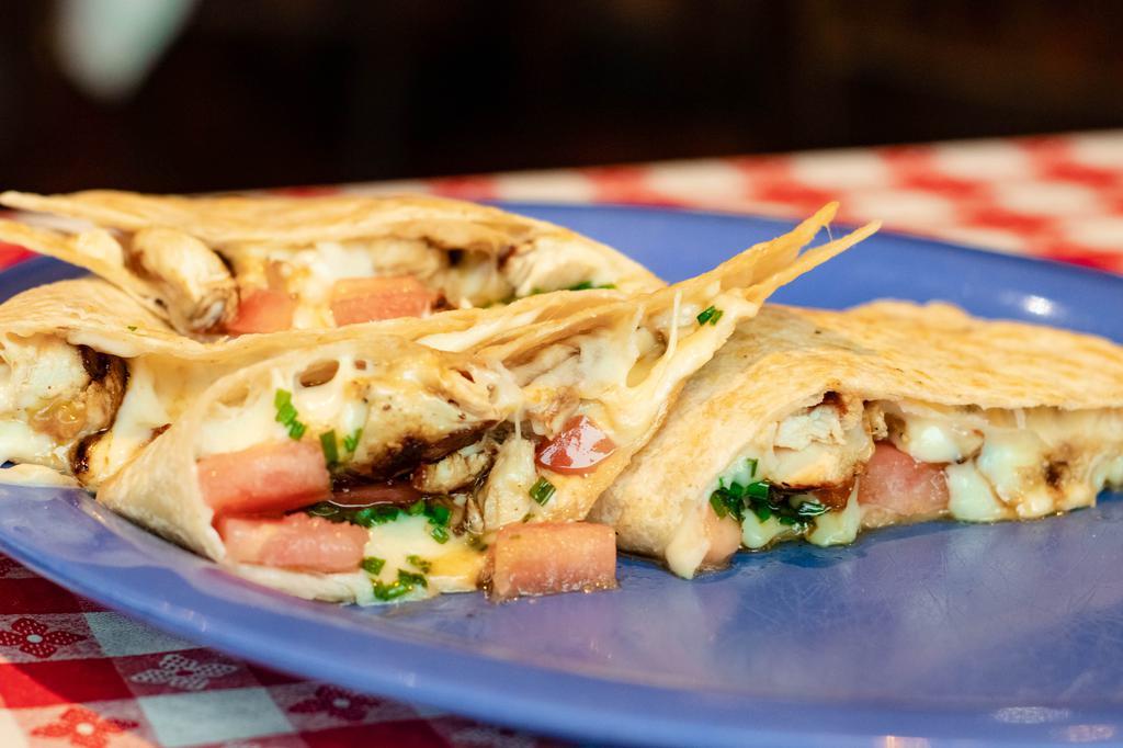 Quesadilla · Beef, chicken, pork, or spinach and mushroom quesadillas. Served with homemade salsa, guacamole, and sour cream.