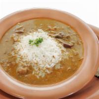 Chicken And Sausage Gumbo · Succulent chicken and sausage gumbo consisting of okra and tomatoes in a spicy brown roux. S...