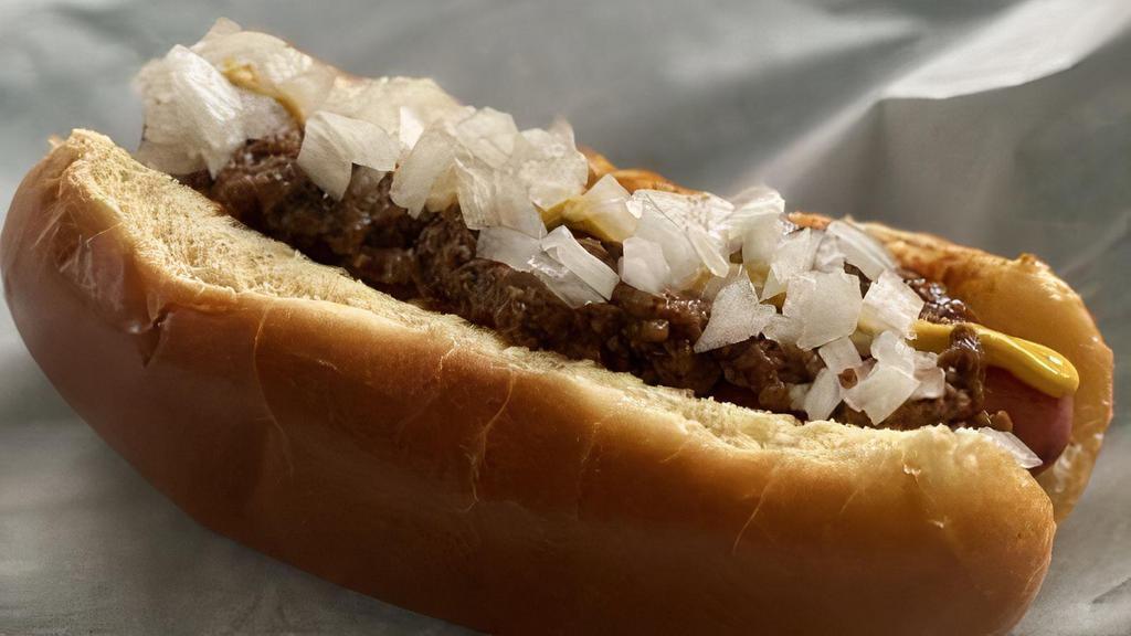 Detroit Style Coney · Koegels vienna coney on a steamed bun, topped with Detroit style chili, onions, and mustard.