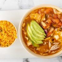 Tortilla Soup · Chicken soup with crispy tortilla slices, tomato, onion, cilantro, avocado and Monterrey che...