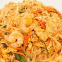 Pad Thai · Tradition Thai Dish, flat rice noodles with chicken shrimp and PEANUTS.