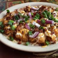 Loaded Tater Tots · New. Crispy tater tots smothered in our home-made chili with melted mixed cheese, crispy bac...
