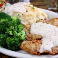 Country Fried Steak · A large hand breaded beef cutlet. Served with home-made country gravy.