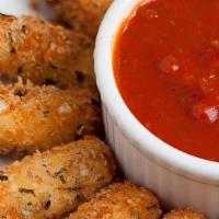 Breaded Mozzarella Cheese Sticks · Breaded cheese sticks served with our marinara sauce.
